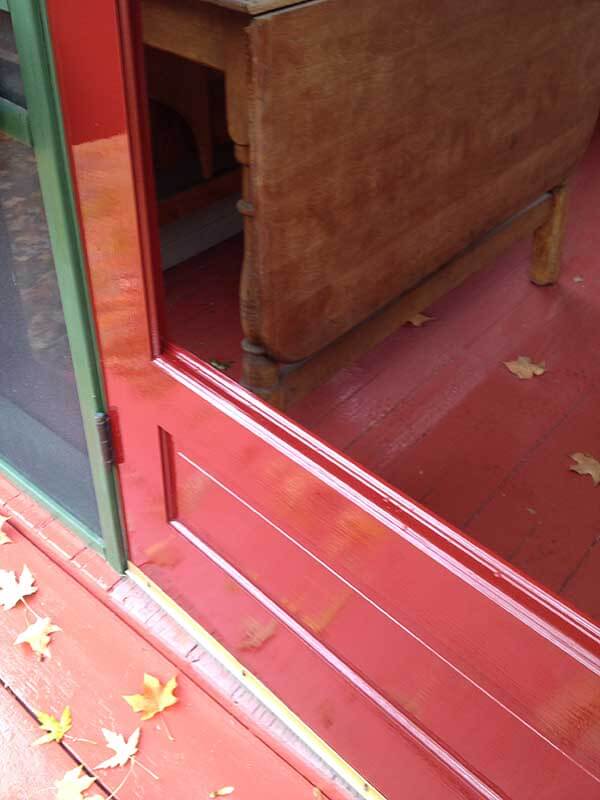 A red front door that makes a stunning statement in high-glosss Fine Paints Of Europe paint