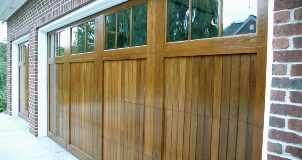 The stunning beauty of repaired and refinished cedar garage doors.