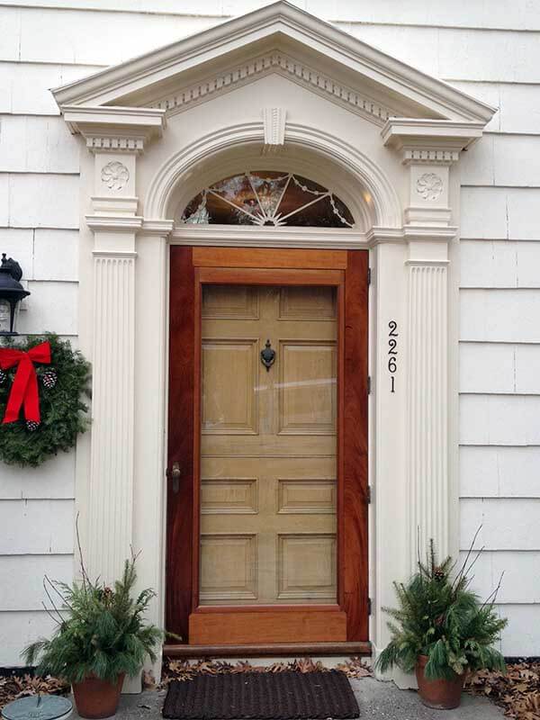 Restored and painted Victorian front door, millwork and door casings